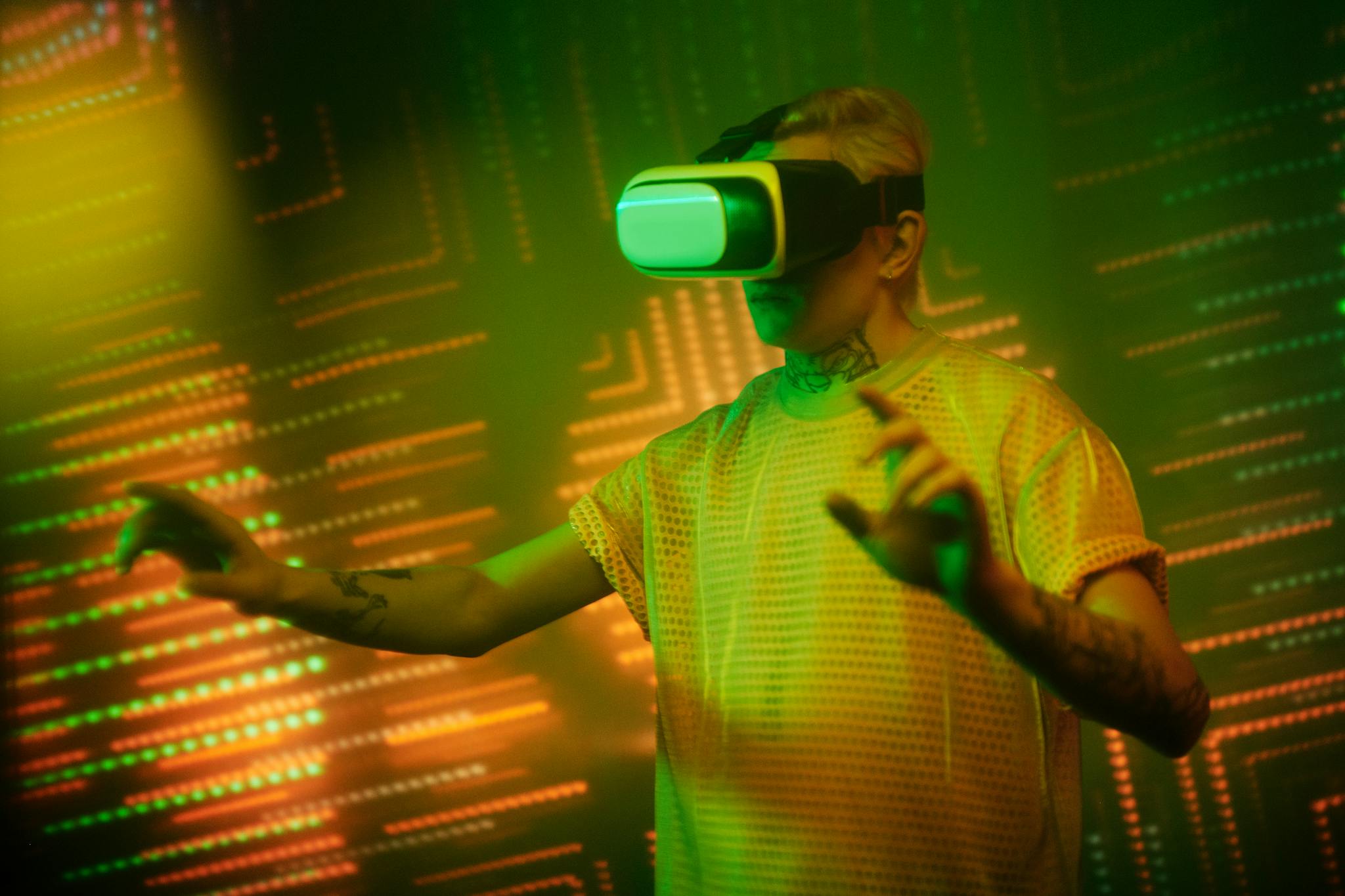 A man wearing a VR headset experiencing a virtual reality game indoors with neon lights.